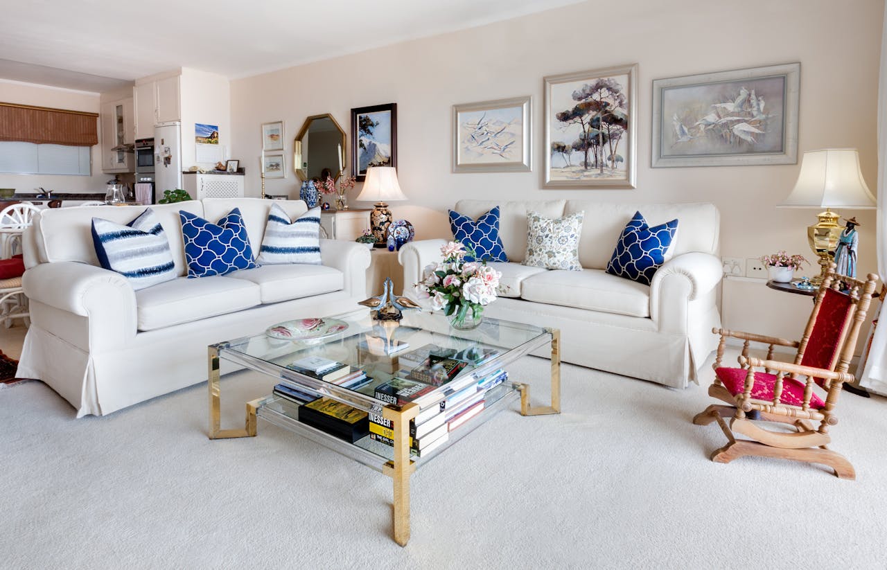 services-01 Modern living room with stylish decor and comfortable white sofas.