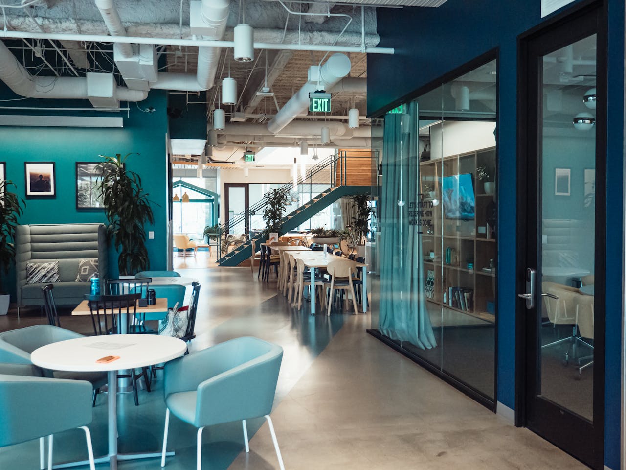 who-we-are Open and collaborative modern office space with stylish furniture and natural lighting.